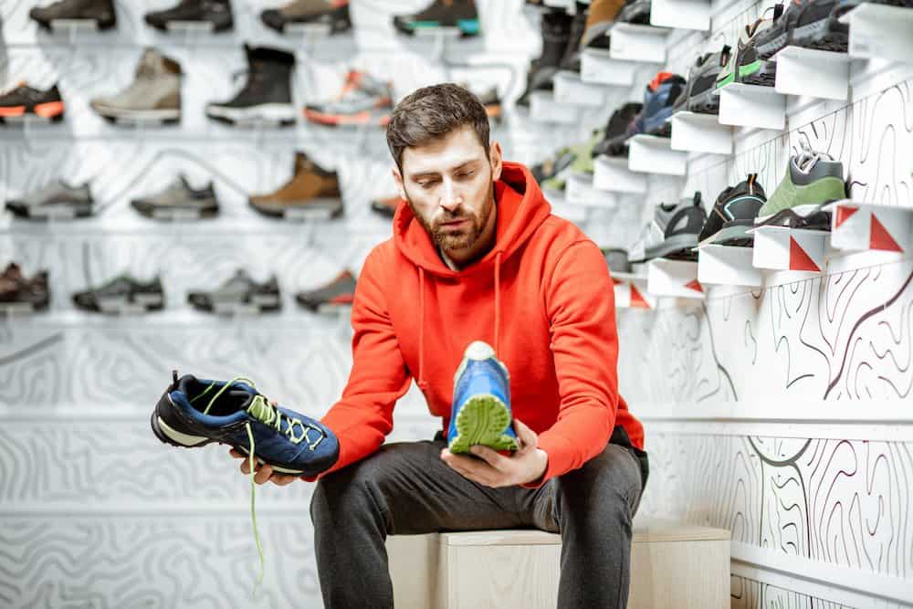 man choosing running shoes in the shop